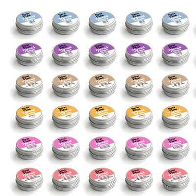 Flatlay showing various Sew Fine Thread Gloss tins from Purple Stitches, handmade beeswax thread conditioner in assorted scents and styles, perfect for sewing and quilting – SKU: SEWFINETHREADGLOSS
Collection of small containers with colorful labels arranged in a grid on a white background.