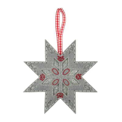 Decorative star ornament with red details and a checkered ribbon on a white background Nordic Snowflake – Felt Decoration Kit (SKU GCK168) with pre-cut red and white felt shapes, thread, needle, and stuffing for making a handmade festive Christmas ornament.