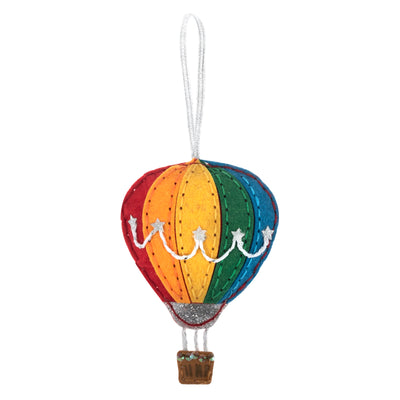 Colourful hot air balloon ornament on a white background Hot Air Balloon – Felt Decoration Kit (SKU GCK231) with pre-cut multicolour felt shapes, thread, needle, and stuffing for making a whimsical handmade ornament