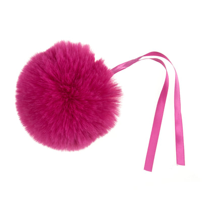 Pink fur pom-pom with a pink ribbon on a white background Faux Fur Pom Pom 11cm – Soft, fluffy pom pom accessory for hats, scarves, bags, keyrings, and crafts – available in multiple colours