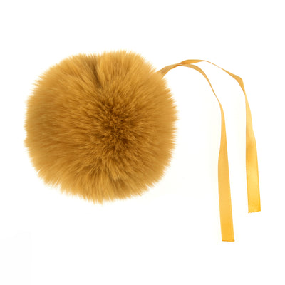 Gold fur pom-pom with a yellow ribbon on a white background Faux Fur Pom Pom 11cm – Soft, fluffy pom pom accessory for hats, scarves, bags, keyrings, and crafts – available in multiple colours