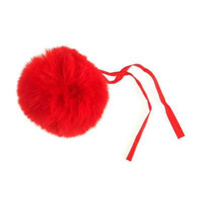 Red fluffy pom-pom with a ribbon on a white background Faux Fur Pom Pom 11cm – Soft, fluffy pom pom accessory for hats, scarves, bags, keyrings, and crafts – available in multiple colours