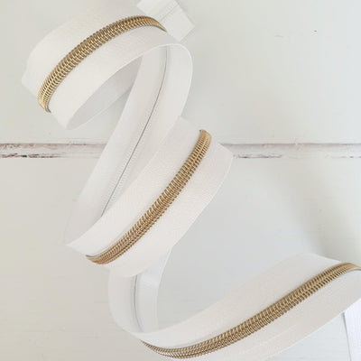 White Zipper Tape with Light Gold Coil Teeth - Size 5 Zip - Shop online and in store at Purple Stitches, Basingstoke, Hampshire UK