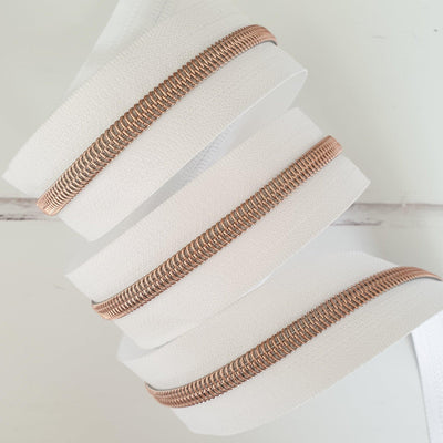 White Zipper Tape with Rose Gold Coil Teeth - Size 5 Zip - Shop online and in store at Purple Stitches, Basingstoke, Hampshire UK