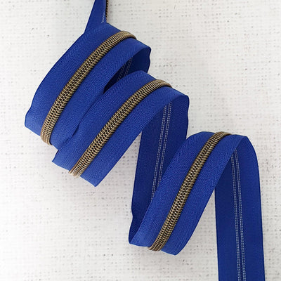 Royal Blue Zipper Tape with Antique Brass Coil Teeth - Size 5 Zip - Shop online and in store at Purple Stitches, Basingstoke, Hampshire UK