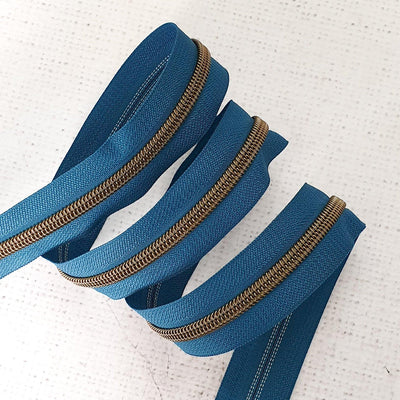 Peacock Blue Zipper Tape with Antique Brass Coil Teeth - Size 5 Zip - Shop online and in store at Purple Stitches, Basingstoke, Hampshire UK