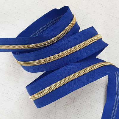 Royal Blue Zipper Tape with Light Gold Coil Teeth - Size 5 Zip - Shop online and in store at Purple Stitches, Basingstoke, Hampshire UK