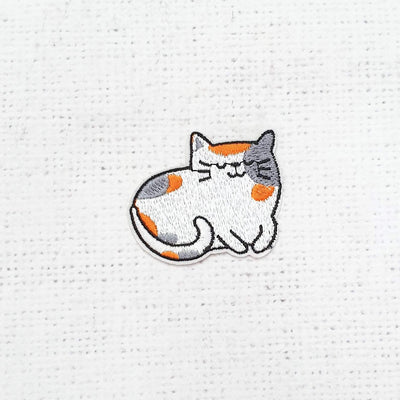 Orange and Grey Spotty Cat - Shop online and in store at Purple Stitches, Basingstoke, Hampshire UK