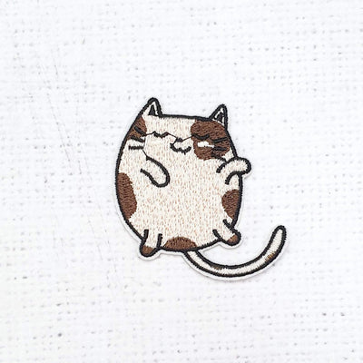 Brown and Beige Spotty face Cat - Purple Stitches